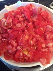 Straining tomatos for salsa on Nutmeg Disrupted